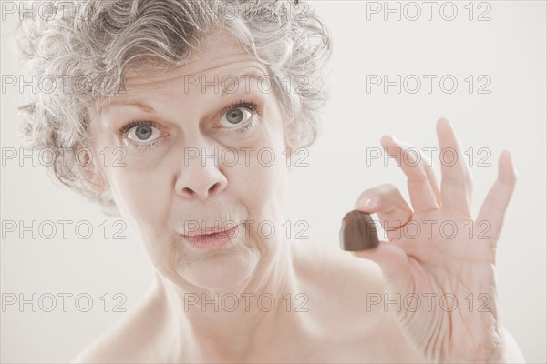 Caucasian woman holding chocolate