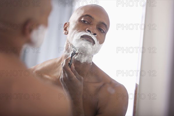 Black man shaving