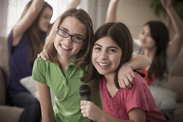 Friends singing karaoke together