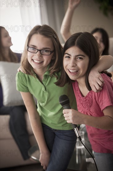 Friends singing karaoke together