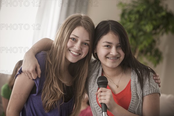 Friends singing karaoke together