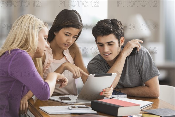 Students looking at digital tablet