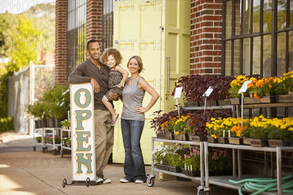 Family standing near florist open sign