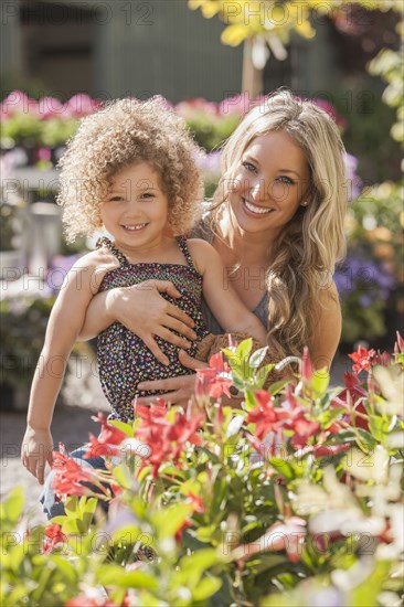 Mother and daughter at plant nursery