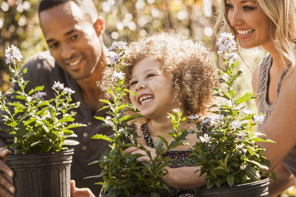 Family looking at plants