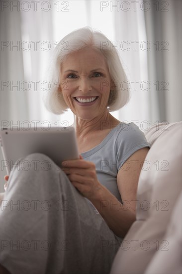 Caucasian woman using digital tablet