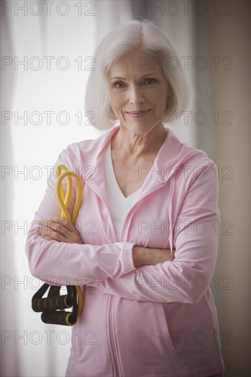 Caucasian woman holding resistance bands