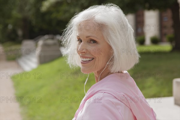 Caucasian woman listening to mp3 player