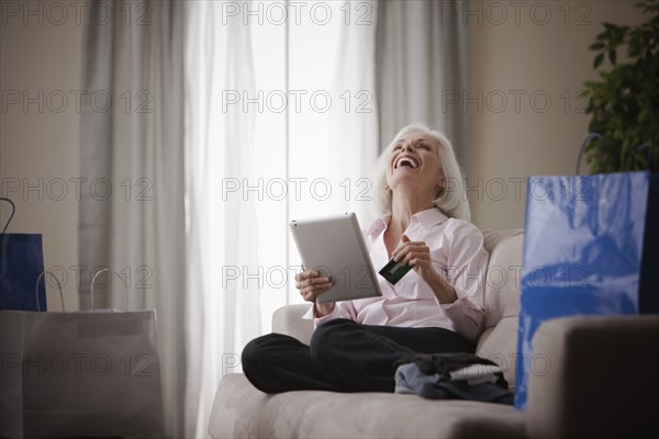 Caucasian woman shopping online with credit card