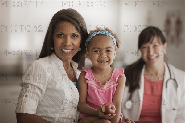 Mother and daughter in doctor's office