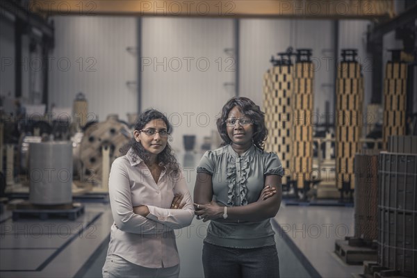 Workers standing together in factory