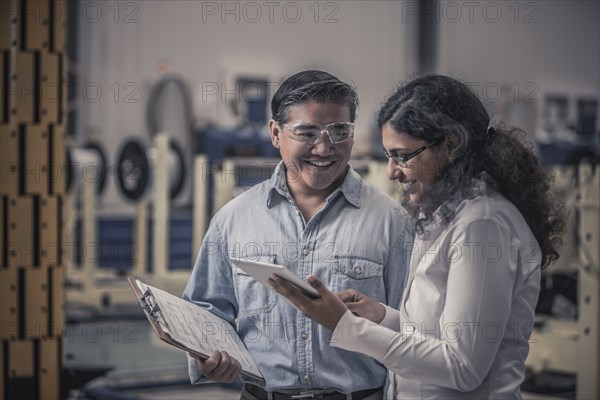 Workers talking in factory