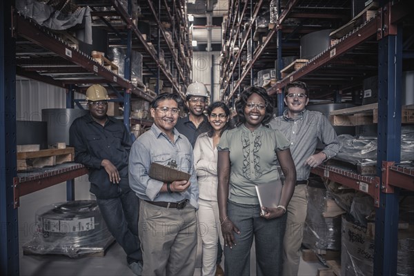 Workers standing together in factory