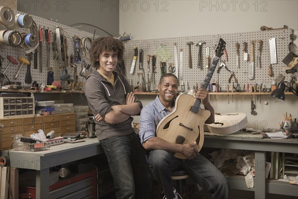 Father and son in music workshop