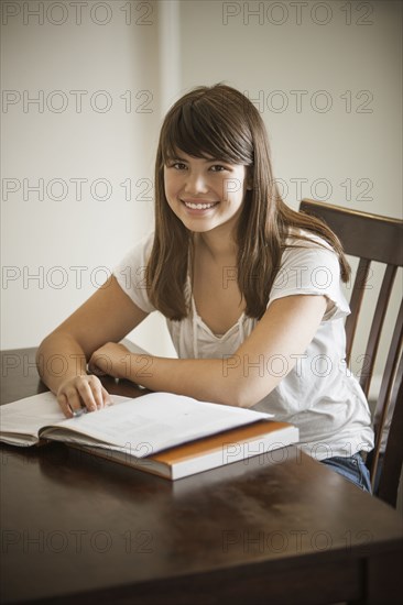 Mixed race woman doing homework