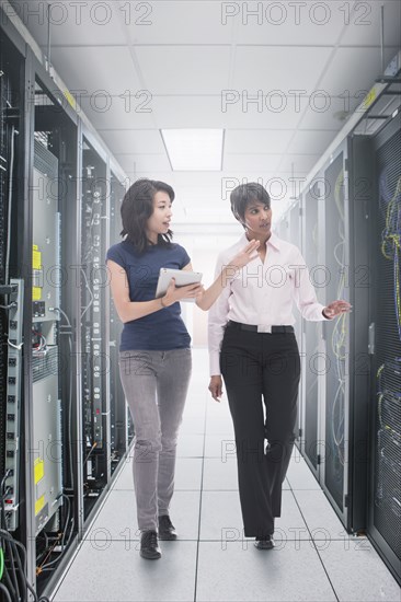 Businessmen working in server room