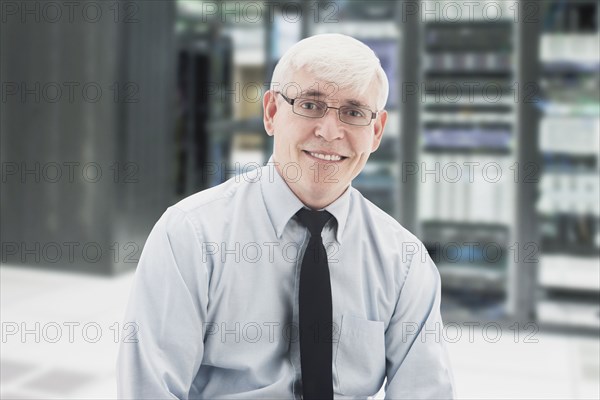 Caucasian businessman in server room