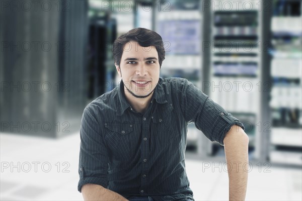 Hispanic businessman in server room