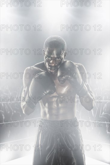 African American boxer in boxing ring