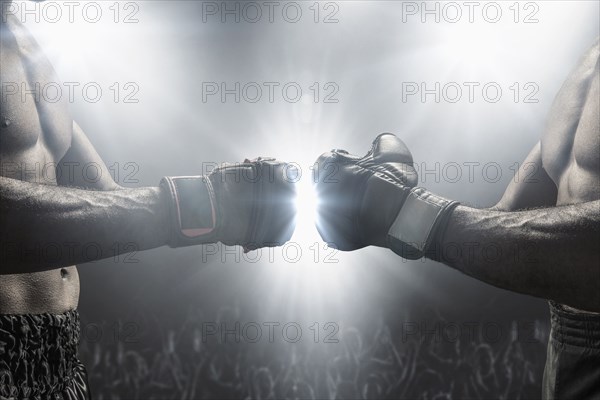 Boxers touching gloves before fight