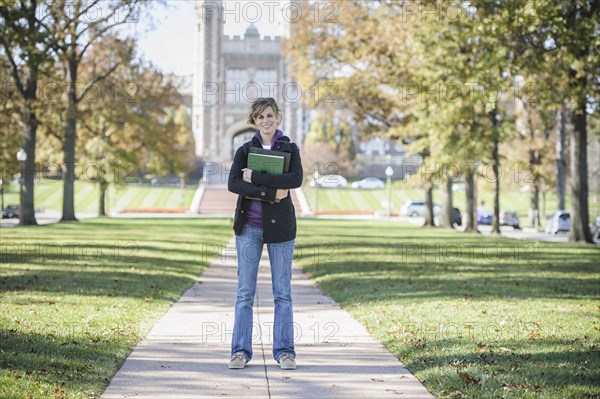 Caucasian student standing on campus