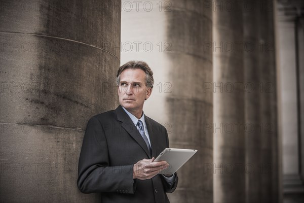 Caucasian businessman using tablet computer