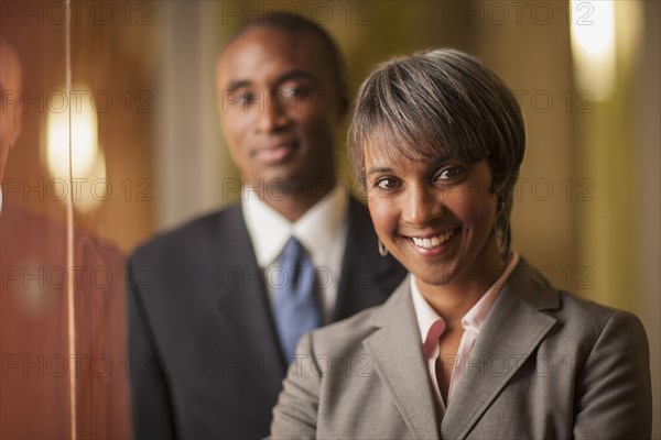 Black business people smiling