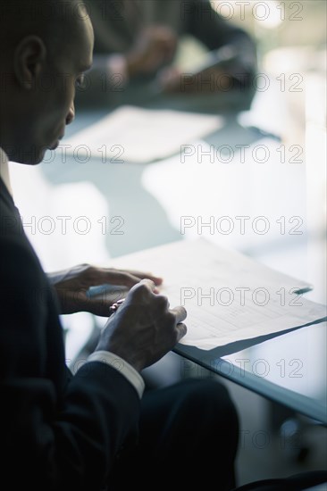 Black businessman reading notes