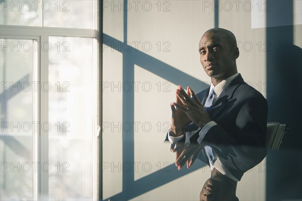 Black businessman sitting at desk