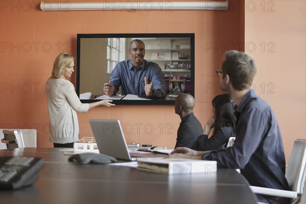 Business people having teleconference in meeting