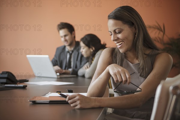 Businesswoman using tablet computer at desk
