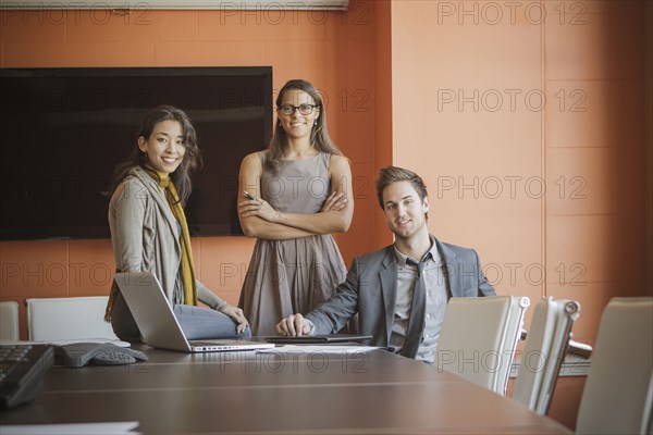 Businesspeople smiling in meeting