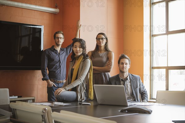 Businesspeople smiling in meeting