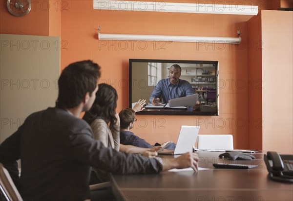 Business people having teleconference in meeting