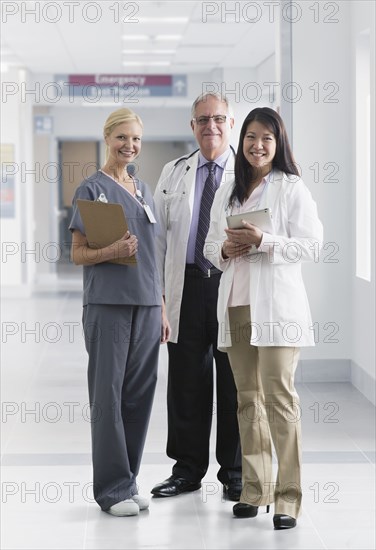 Doctors and nurse smiling in hospital