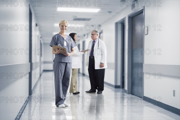 Caucasian nurse smiling in hospital