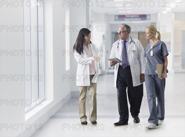 Doctors and nurse talking in hospital