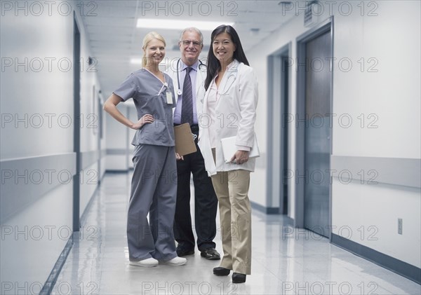 Doctors and nurse smiling in hospital