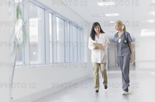 Doctor and nurse talking in hospital