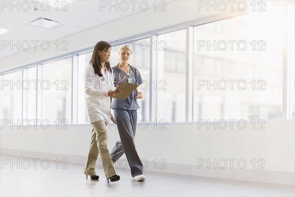 Doctor and nurse talking in hospital