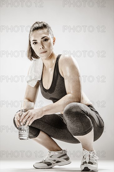 Caucasian woman resting after workout