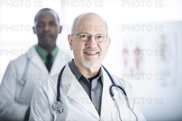 Doctors smiling in office