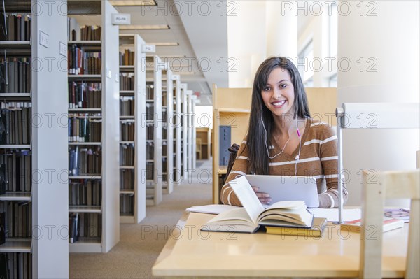 Student working at desk in library