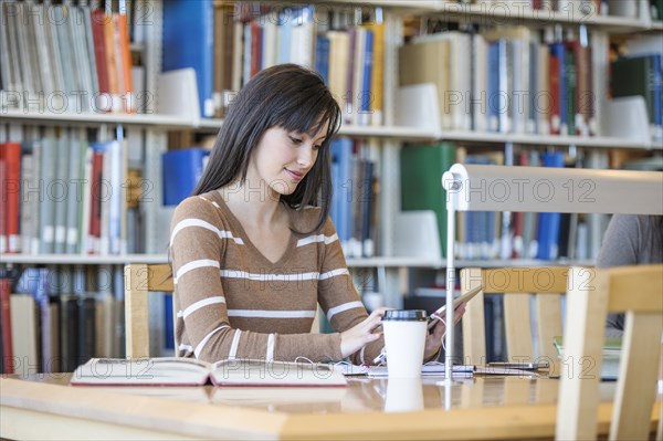 Student working at desk in library