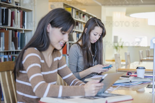 Students working at desk in library