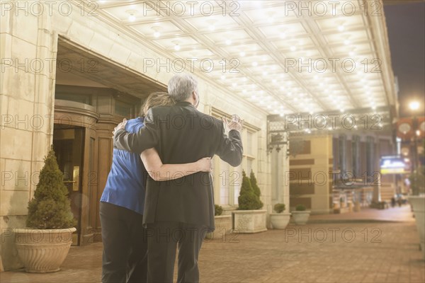 Caucasian couple hugging outdoors