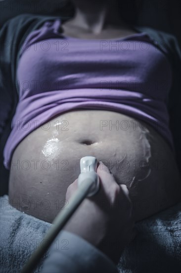 Pregnant woman having sonogram