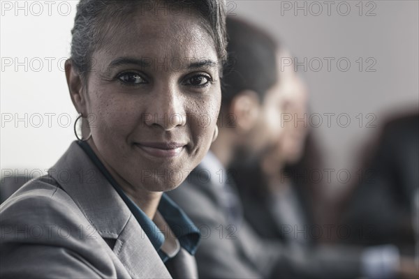 Businesswoman smiling in meeting