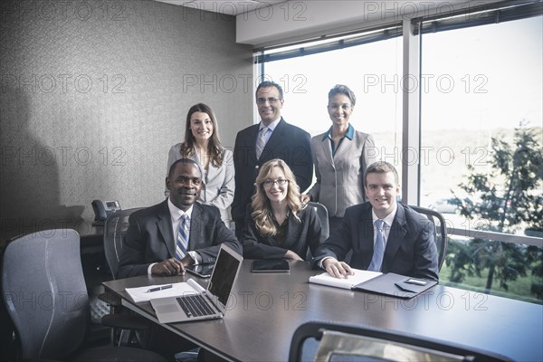 Business people smiling in meeting