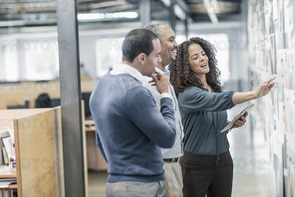 Business people using digital tablet in office